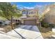 Charming two-story home with a well-maintained front yard and attached two-car garage at 6837 Dragonfly Rock St, Las Vegas, NV 89148