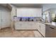 Bright kitchen featuring granite countertops, stainless steel appliances, and ample cabinet space at 6837 Dragonfly Rock St, Las Vegas, NV 89148