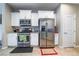 Modern kitchen with stainless steel appliances, granite countertops, and white cabinets at 6837 Dragonfly Rock St, Las Vegas, NV 89148