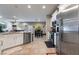 Open concept kitchen with stainless steel appliances and a view of the dining and living area at 6837 Dragonfly Rock St, Las Vegas, NV 89148