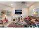 Comfortable living room features a modern entertainment center and cozy leather seating at 6837 Dragonfly Rock St, Las Vegas, NV 89148