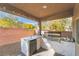 Outdoor kitchen featuring a built-in grill and bar with string lights at 6837 Dragonfly Rock St, Las Vegas, NV 89148