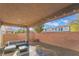Covered patio area with stylish outdoor seating and gravel at 6837 Dragonfly Rock St, Las Vegas, NV 89148