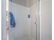 Tiled shower features glass door and shower head at 6837 Dragonfly Rock St, Las Vegas, NV 89148