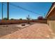 Expansive backyard with a tiled patio area perfect for outdoor entertaining and relaxation at 688 Arrowhead Canyon Dr, Henderson, NV 89002