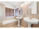 Bathroom featuring dual vanities and soaking tub at 688 Arrowhead Canyon Dr, Henderson, NV 89002