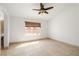 Empty bedroom with large window and ceiling fan at 688 Arrowhead Canyon Dr, Henderson, NV 89002