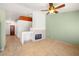 Open-concept living room with fireplace and views to other rooms at 688 Arrowhead Canyon Dr, Henderson, NV 89002