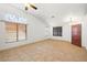 Bright and airy living room showcasing large windows and neutral decor at 688 Arrowhead Canyon Dr, Henderson, NV 89002