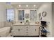 Bathroom featuring double sink vanity with tile countertops, decor, and free standing tub at 729 Sir James Bridge Way, Las Vegas, NV 89145