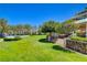 Scenic view of a gazebo with playground view, set amidst a sprawling green lawn with mature trees at 729 Sir James Bridge Way, Las Vegas, NV 89145
