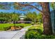 Beautifully landscaped park featuring a gazebo, benches, and walking paths amid lush greenery and mature trees at 729 Sir James Bridge Way, Las Vegas, NV 89145