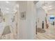 Hallway with wood floors, chandelier, and view into the kitchen at 729 Sir James Bridge Way, Las Vegas, NV 89145