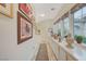 Hallway with cabinets, decor, and natural light from windows at 729 Sir James Bridge Way, Las Vegas, NV 89145