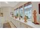 Bright hallway with custom cabinets, decor, and large windows allowing for plenty of natural light to enter the space at 729 Sir James Bridge Way, Las Vegas, NV 89145