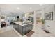 Open kitchen featuring a center island, stainless appliances, and light wood-look floors at 729 Sir James Bridge Way, Las Vegas, NV 89145