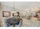 Open-concept living space showcasing the living, dining, and office areas in a seamlessly connected and stylish design at 729 Sir James Bridge Way, Las Vegas, NV 89145