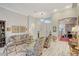 Bright and airy living room featuring high ceilings, elegant furnishings, and a seamless flow into other spaces at 729 Sir James Bridge Way, Las Vegas, NV 89145
