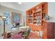 Office space with a wooden bookcase and decorative accents at 729 Sir James Bridge Way, Las Vegas, NV 89145