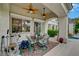 Covered patio featuring a dining set, exercise equipment, and roll-down sunshades at 729 Sir James Bridge Way, Las Vegas, NV 89145