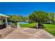 Serene park view with a gazebo and a playground, bordered by verdant lawns and mature trees, offering a Gathering setting at 729 Sir James Bridge Way, Las Vegas, NV 89145