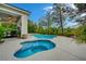 Backyard with a pool, spa, and covered patio with a dining area at 729 Sir James Bridge Way, Las Vegas, NV 89145