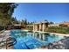 Community pool with clear water and surrounding trees at 729 Sir James Bridge Way, Las Vegas, NV 89145