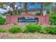 Brick sign for Kew Gardens neighborhood with manicured landscaping at 729 Sir James Bridge Way, Las Vegas, NV 89145