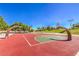 A colorful community basketball court surrounded by lush greenery and open space at 7410 Bridlehorne Ave, Las Vegas, NV 89131