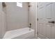 Clean bathroom featuring a soaking tub with modern faucets and bright neutral-toned walls at 7410 Bridlehorne Ave, Las Vegas, NV 89131