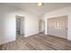 The bedroom offers wood-look floors and includes a closet and access to an ensuite bathroom at 7410 Bridlehorne Ave, Las Vegas, NV 89131