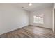 A simple bedroom with wood-look floors is a blank canvas for your personal touch at 7410 Bridlehorne Ave, Las Vegas, NV 89131