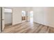 Neutral bedroom with wood floors showcasing multiple doorways and a spacious closet at 7410 Bridlehorne Ave, Las Vegas, NV 89131