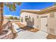 A single-story home with a walkway and a clean exterior, complemented by desert landscaping at 7410 Bridlehorne Ave, Las Vegas, NV 89131