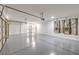 A spacious garage featuring epoxy floors, providing a clean and durable surface for parking and storage at 7410 Bridlehorne Ave, Las Vegas, NV 89131