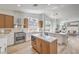 Spacious kitchen with stainless steel appliances, dual islands, and natural light from the many windows at 7410 Bridlehorne Ave, Las Vegas, NV 89131