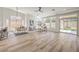Inviting living area with multiple windows, hardwood floors and a slider to the backyard at 7410 Bridlehorne Ave, Las Vegas, NV 89131