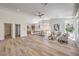 Spacious open living area with light wood floors, lots of natural light, and a great open floor plan at 7410 Bridlehorne Ave, Las Vegas, NV 89131