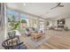 Bright and airy living space with patio access, contemporary furnishings and hardwood floors at 7410 Bridlehorne Ave, Las Vegas, NV 89131