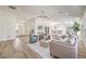 Open concept living room with modern furnishings, wood floors, and bright, airy feel at 7410 Bridlehorne Ave, Las Vegas, NV 89131