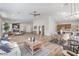 Spacious living room boasts an open floor plan connecting the kitchen, dining, and living areas at 7410 Bridlehorne Ave, Las Vegas, NV 89131