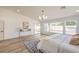 Bright main bedroom featuring natural light, clean decor, and backyard access at 7410 Bridlehorne Ave, Las Vegas, NV 89131