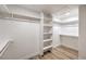 Spacious walk-in closet features built-in shelving and hanging rods for optimal storage at 7410 Bridlehorne Ave, Las Vegas, NV 89131