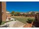 Backyard features grass, desert landscaping, partial patio, and block perimeter wall at 7690 Morning Lake Dr, Las Vegas, NV 89131