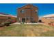 Private backyard with a grassy area, patio space, and mature landscaping, offering a serene retreat at 7690 Morning Lake Dr, Las Vegas, NV 89131