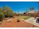 Well-maintained backyard with lush landscaping, providing a peaceful outdoor escape at 7690 Morning Lake Dr, Las Vegas, NV 89131