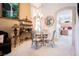 Cozy dining area with a chandelier, views of the kitchen, and ample natural light at 7690 Morning Lake Dr, Las Vegas, NV 89131