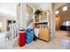 Entryway with staircase and a decorative cabinet with glass doors at 7690 Morning Lake Dr, Las Vegas, NV 89131