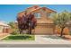Charming two-story home with manicured lawn, desert landscaping, and a two car garage at 7690 Morning Lake Dr, Las Vegas, NV 89131