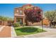 Charming two-story home with manicured lawn, desert landscaping, and neutral-tone exterior paint at 7690 Morning Lake Dr, Las Vegas, NV 89131